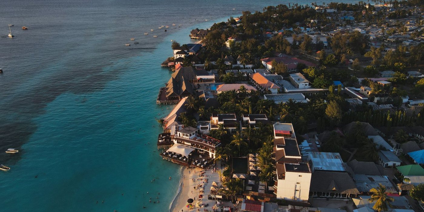 Beach resort beside clear blue water